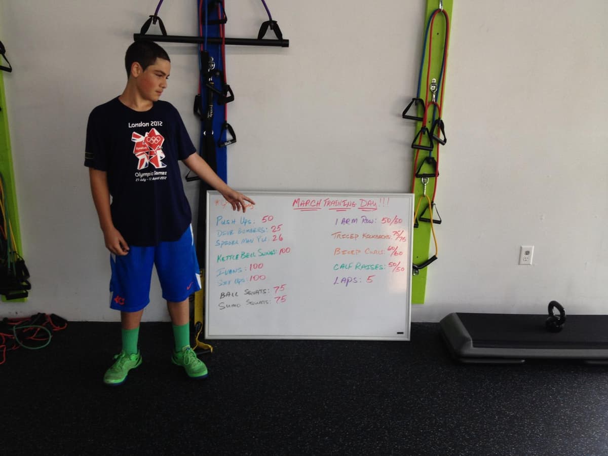 Pedro pointing to his workout for that session